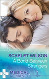 A Bond Between Strangers (Mills & Boon Medical) by Scarlet Wilson