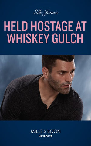 Held Hostage At Whiskey Gulch (The Outriders Series, Book 3) (Mills & Boon Heroes) (9780008921910)